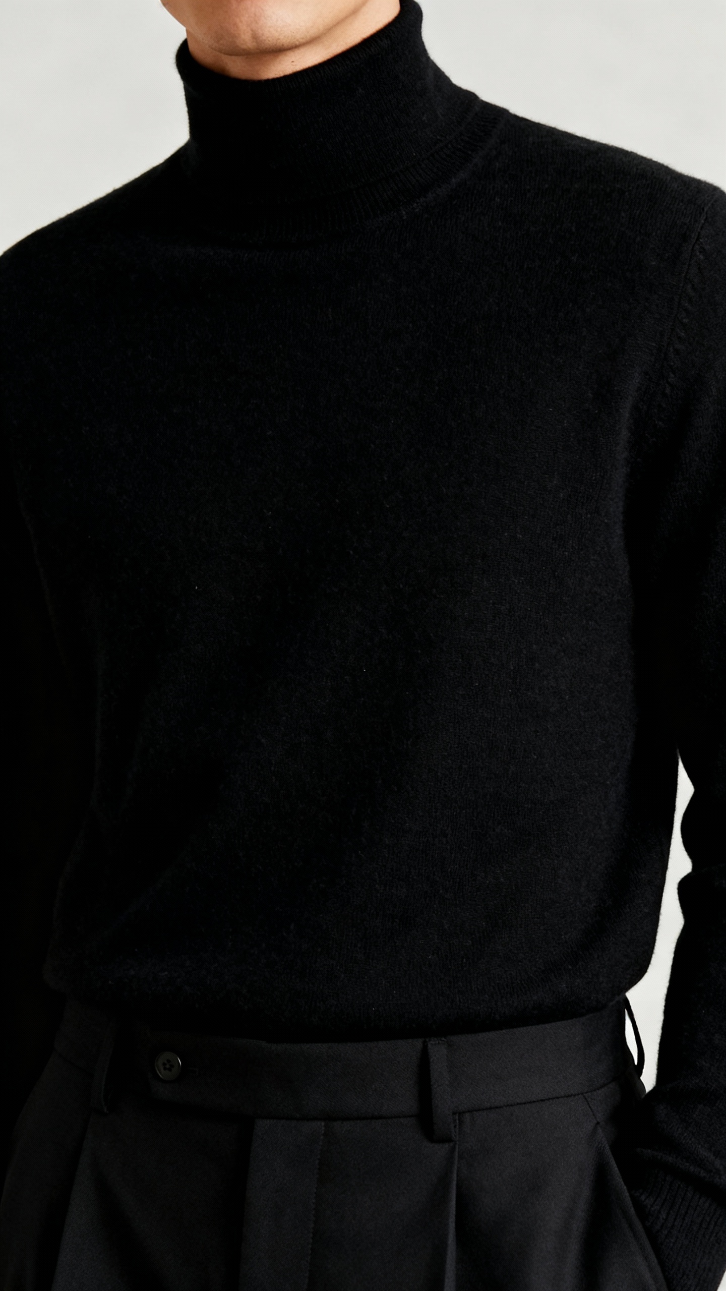 black merino turtleneck, tailored trousers, subtle texture close-up