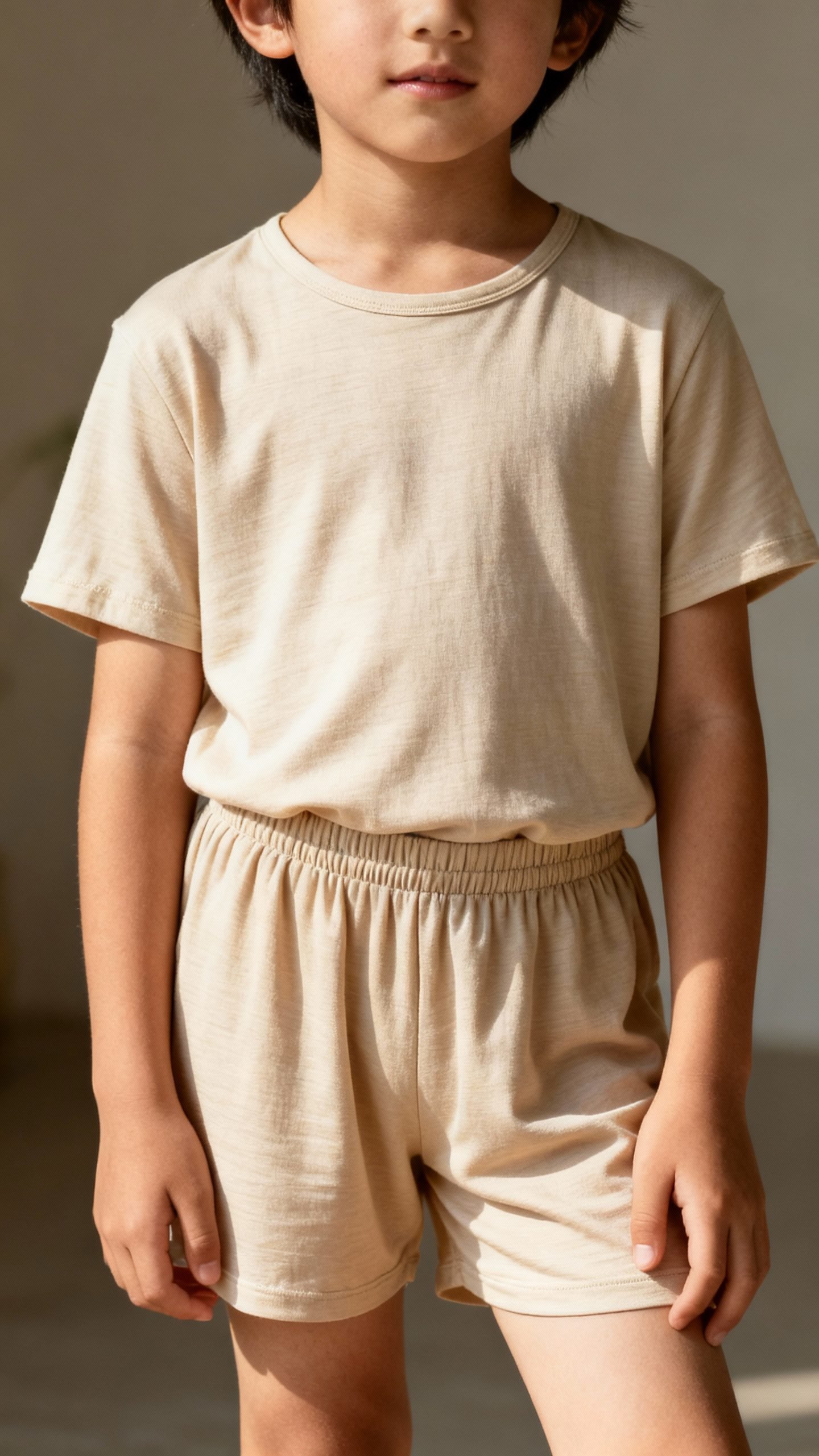 kid in bamboo viscose tee, elastic shorts, natural light